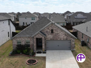 Aerial view of a charming single-story home in royse city