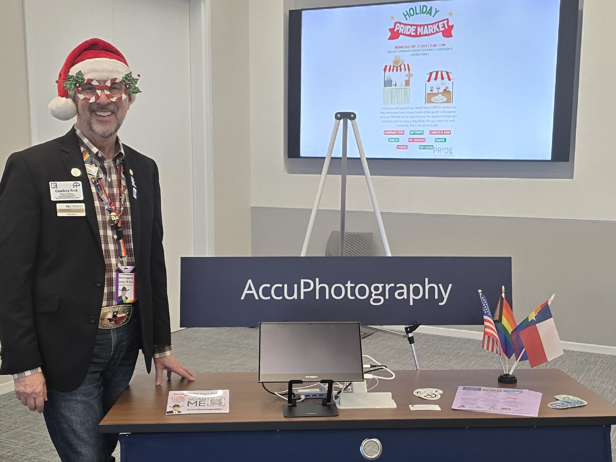 Rick standing by his vendor table at the chase pride showcase event, showcasing accuphotography services in plano.