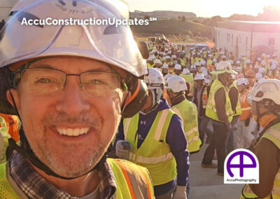 Participating in a morning safety huddle with 1,200 crew members before using AccuConstructionUpdates and Buildots 360° technology on a corporate expansion project in Westlake, Texas.