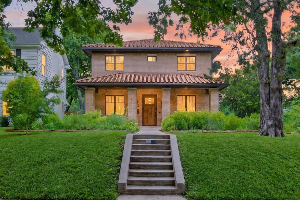Dusk twilight exterior view of a Spanish-style Dallas Texas rental property showcasing professional rental property photography.