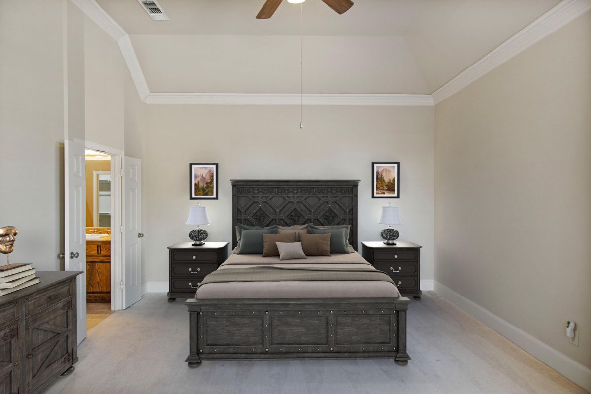 Digitally staged primary bedroom featuring modern dark wood furniture, vaulted ceilings, and tasteful decor for a rental property listing.